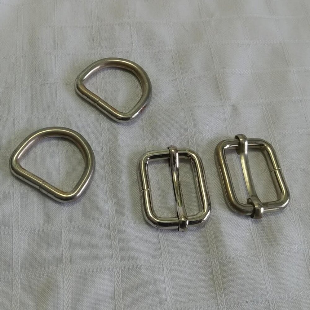 E- Two fasteners for adjusting overalls straps